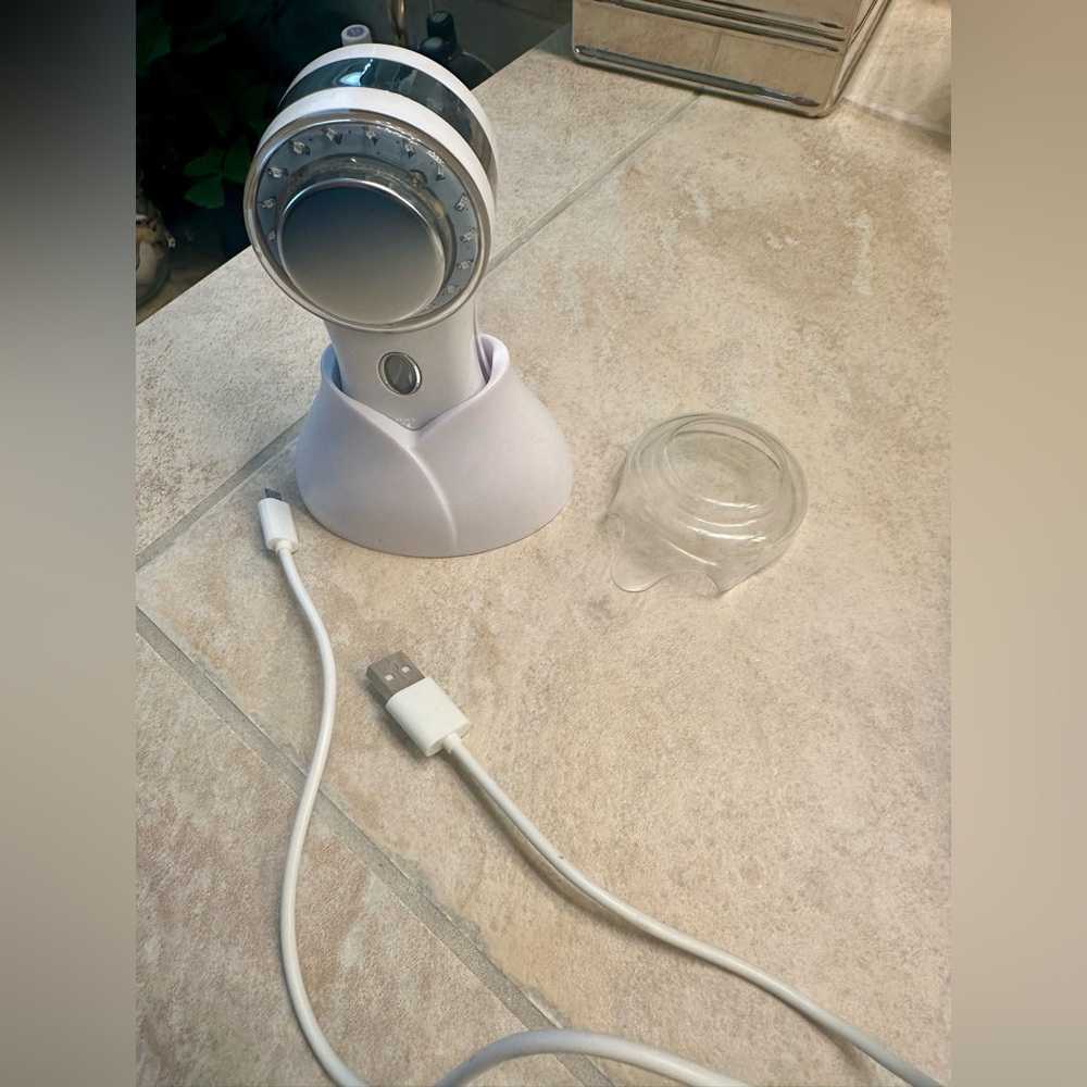 My Skin Buddy device with stand, protective cover and charging cord